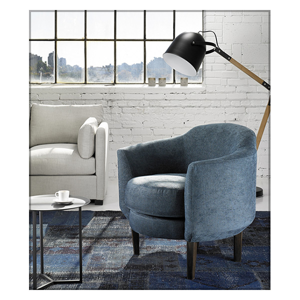 blue chair with floor lamp in loft